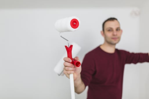 blurred-man-with-paint-rollers